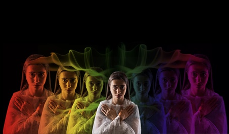 young girl meditating with aura colors